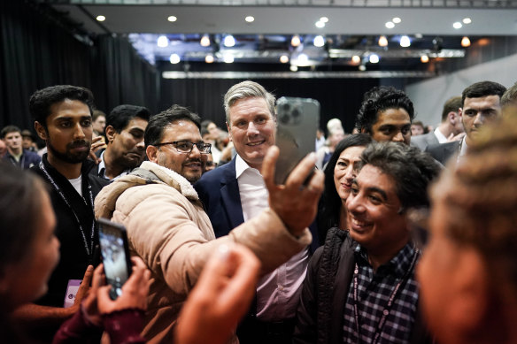 UK Opposition Leader Keir Starmer meets party faithful during the Labour conference in Liverpool.