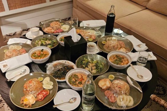 Uneaten meals left on a table in the Grand Hyatt Erawan Hotel room where six people were found dead.