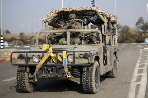 Israeli soldiers make their way to the southern Israeli border with Gaza on November 16.