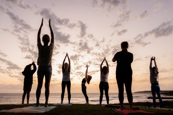 Yoga instructor Shivani O’Brien leads an outdoor class at Shelly Beach in Cronulla.