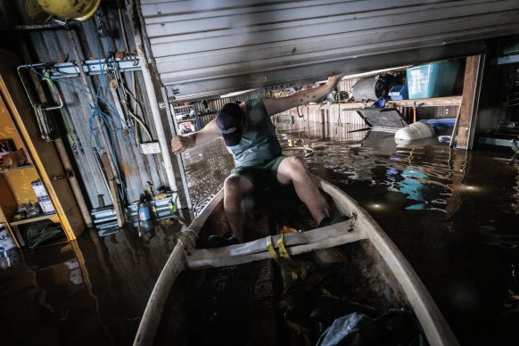 Broady Logan surveys the damage around his Gunnedah home. Broady and his young family have no plans to move despite this being the “8th time the house has flooded since November 2021”. 