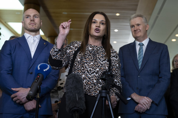 Senators Jacqui Lambie and David Pocock with Burke on Thursday.