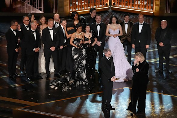 Paul Thomas Anderson and Sara Murphy accept the award for best picture for One Battle After Another.