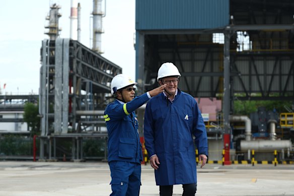 Prime Minister Anthony Albanese with Singapore Refining Company  chief Eso Thomas on a tour Jurong Island on Friday.