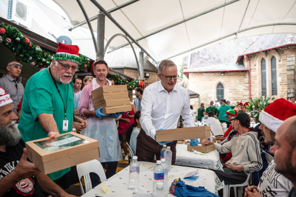Prime Minister Anthony Albanese hands out lunch on Christmas Day.