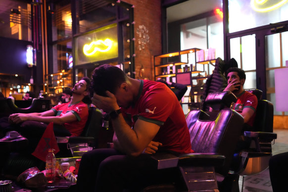 Moroccan fans distraught in a Rabat barbershop.