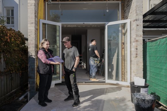 Project manager Sarah Wood, pictured with builder Ian Broughton in Annandale, said homeowners had moved away from major renovations.