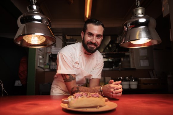 Slip Inn and El Loco Venues executive chef Tal Buchnik with a Danish hot dog created for the occasion.