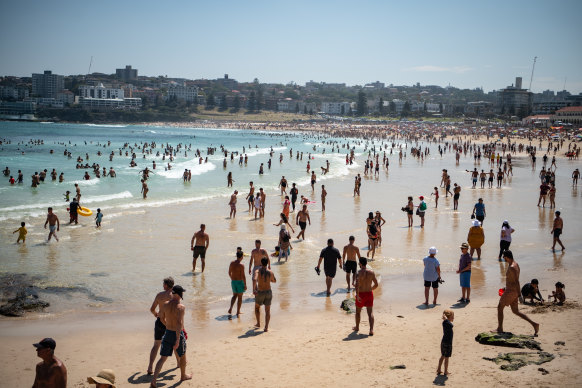 Beachgoers enjoy the sun and sand at Bondi.