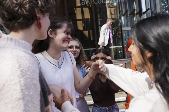 Young climate activist Luca Saunders shows her disappointment after the verdict on a climate case brought by  a group of eight children was dismissed.