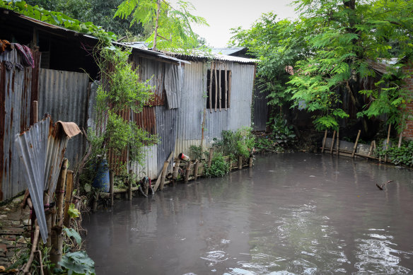 A sweatshop worker room near polluted water in Bangladesh.