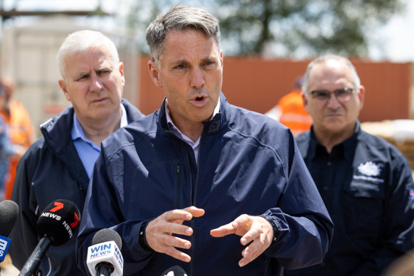 Acting Prime Minister Richard Marles addresses the media in Forbes alongside Riverina MP Michael McCormack (left) and Emergency Management Australia director-general Joe Buffone.