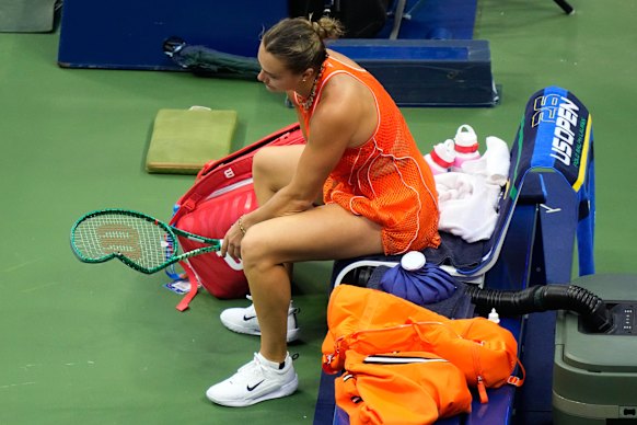 Sabalenka and her smashed racquet after she lost the 2026 US Open final.