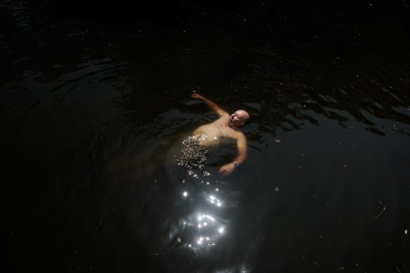 Local resident Barney Soloman swims in the Cooks River at Boat Harbour, Hurlstone Park (it’s not recommended).