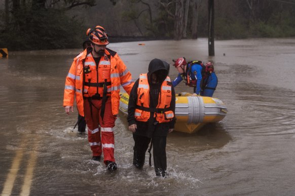 Lansvale residents Jack and Jamarcus, along with their pets Hondo and Buffy are evacuated by the NSW SES Kogarah Unit 