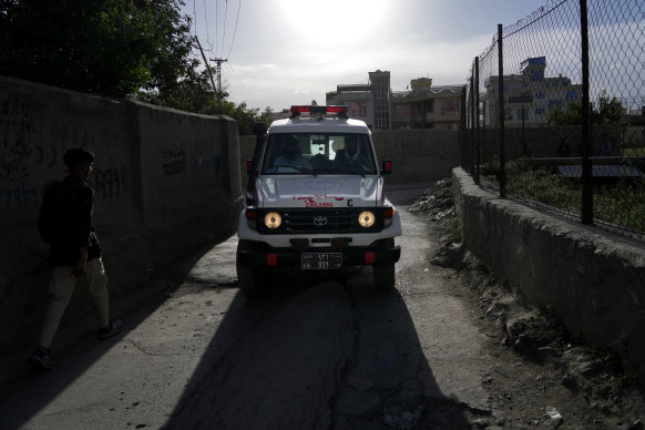 Ambulance carrying wounded people leaves the site of an explosion.