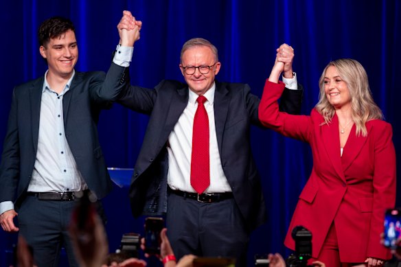Prime Minister Anthony Albanese flanked by son Nathan and fiancee Jodie Haydon on election night. 