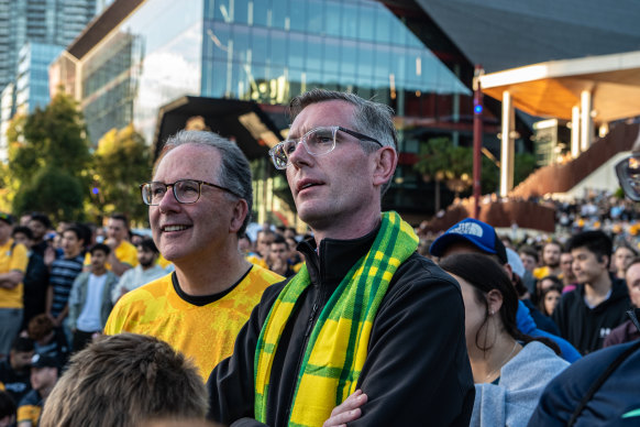 Alister Henskens (left) and Premier Dominic Perrottet watched the Socceroos at the Sydney live site last weekend.