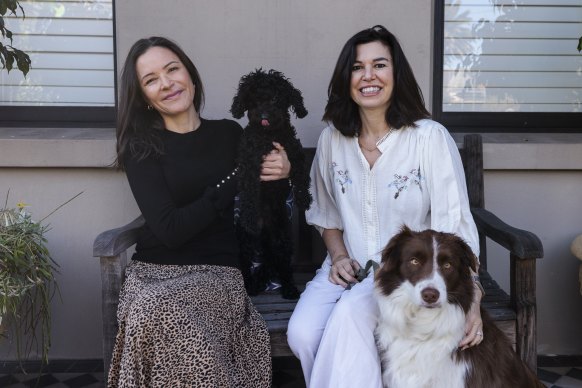 Lauren Healey and Genie Pepper share dog-sitting duties.
