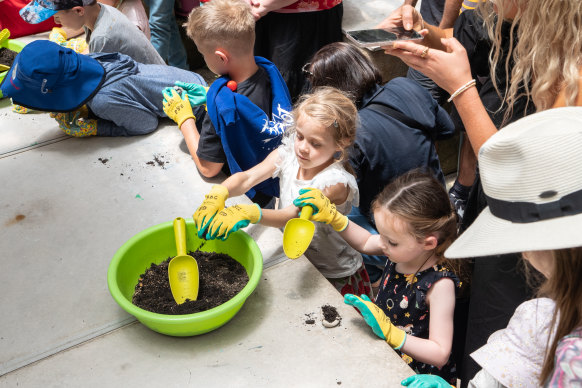 Children make seed bombs at the Royal Botanic Garden on Wednesday.