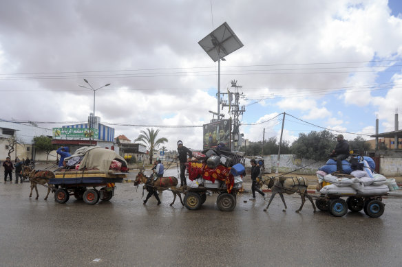 Palestinians flee from the eastern side of the southern Gaza city of Rafah after the Israeli army orders them to evacuate ahead of a military operation.
