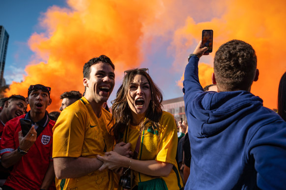 Fans celebrate a Socceroos’ goal in Sydney on Sunday.