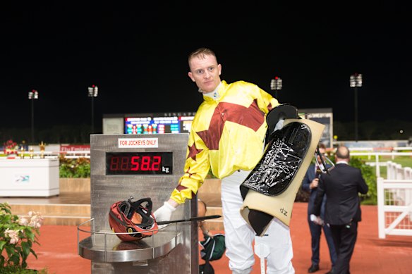 Australian jockey Zac Purton returns to scale after winning a race in Singapore.