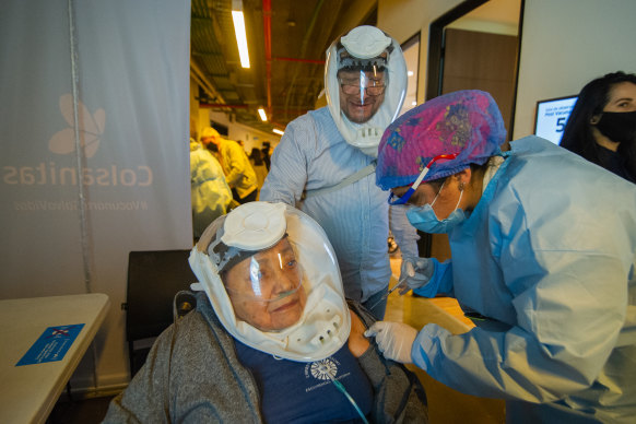 In Bogota in Colombia, the first shot of China’s Sinovac is given to a woman aged over 80.