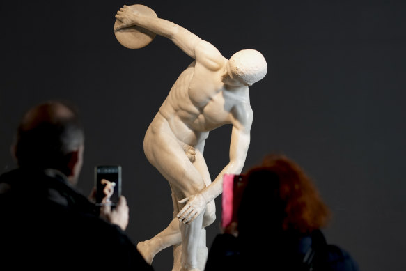 Visitors admire the Discobolus Palombara, a 2nd Century Roman copy of a long-lost Greek bronze original, on display at Rome’s National Roman Museum.