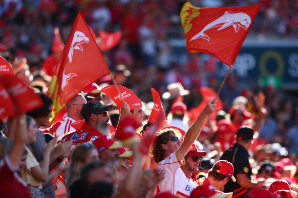 Dolphins fans cheer their team in their inaugural game.