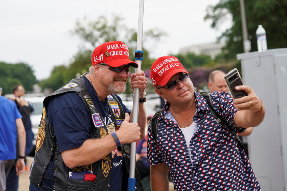 Supporters take a photo of themselves.