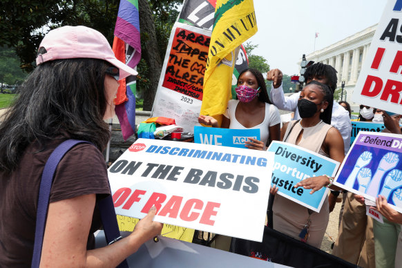 Demonstrators for and against the US Supreme Court decision on affirmative action confront each other, in Washington DC.