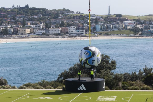 A 4-metre replica of the offical ball for the upcoming 2023 FIFA women’s World Cup hangs over Bondi.