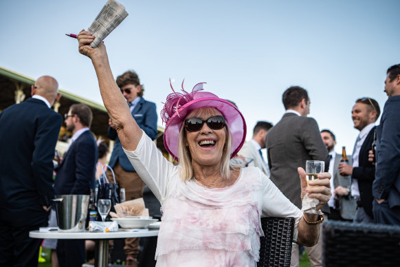 A happy punter at Royal Randwick on Saturday.