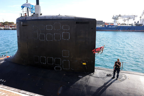 US Navy personnel stand guard aboard the USS Minnesota during its visit to Fremantle.
