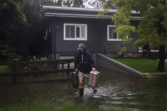 Brooke Greenhouse evacuates a property in Windsor that has flooded for the second consecutive year.