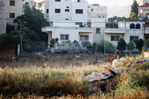 An Israeli security forces vehicle drives along a road during an Israeli military operation in Jenin, in the Israeli-occupied West Bank, on July 3.