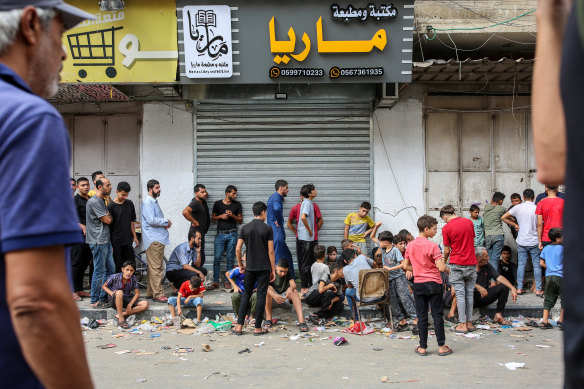 Palestinians line up at a bakery in Khan Younis, in the southern Gaza Strip.