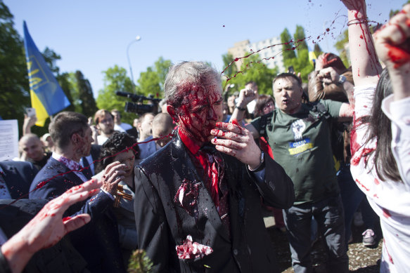 Russian Ambassador to Poland, Ambassador Sergey Andreev is covered with red paint in Warsaw, Poland.