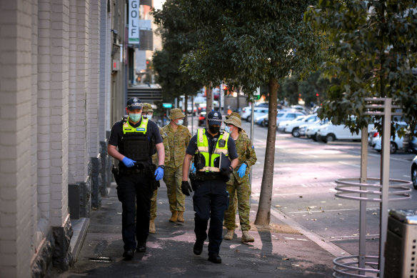 Victoria Police and military personnel patrolling Melbourne during the stage 4 lockdown on August 4, 2020.