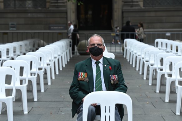 John Hitchem, 73, an army reservist for 37 years, waits for the Remembrance Day ceremony to begin.