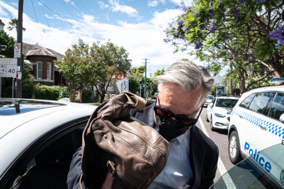 Former celebrity nose surgeon William Mooney leaves Waverley Local Court after escaping conviction for cocaine possession.