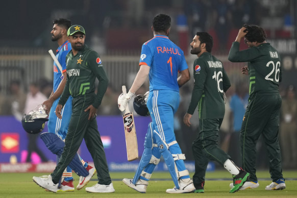 Pakistan’s captain Babar Azam and India’s KL Rahul after India’s win.
