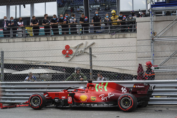 Charles Leclerc sits in his Ferrari after crashing during qualifying.