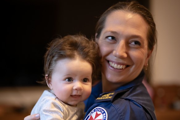 Holzheimer reunited with baby Josephine, three months after delivering her during a night shift.