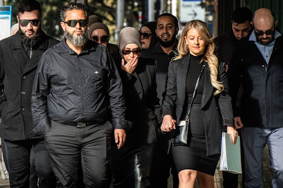 Former Bankstown Hospital nurse, Sarah Abu Lebdeh (centre), at the Downing Centre Courts in Sydney in June.