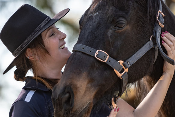 Elizabeth Milinkovic with an ex-racing thoroughbred horse named Danny.