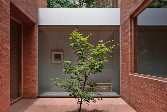 A point of difference is a central courtyard that separates the private wing from the more public side of the home.