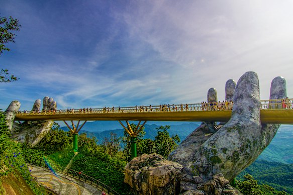 The Golden Bridge is lifted by two giant hands in the tourist resort of Ba Na Hills in Da Nang, Vietnam.