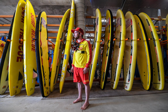 Jameson Trainor with surf rescue equipment at the Jan Juc surf lifesaving club. 